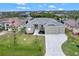 Aerial view of a house with a large yard at 10508 Mcalester Cir, Port Charlotte, FL 33981