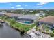 Aerial view of a canal front house with pool at 10508 Mcalester Cir, Port Charlotte, FL 33981