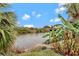 Scenic view of a canal with lush tropical foliage at 10508 Mcalester Cir, Port Charlotte, FL 33981