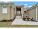 Front entrance with stone walkway leading to double doors at 10508 Mcalester Cir, Port Charlotte, FL 33981