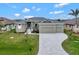 Modern house exterior with a three-car garage at 10508 Mcalester Cir, Port Charlotte, FL 33981