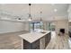 Modern kitchen with white cabinets, center island, and pool view at 10508 Mcalester Cir, Port Charlotte, FL 33981