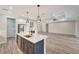 Dark-grey kitchen island with white countertop and stainless steel appliances at 10508 Mcalester Cir, Port Charlotte, FL 33981