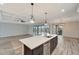 Bright kitchen featuring white shaker cabinets, quartz countertops and stainless steel appliances at 10508 Mcalester Cir, Port Charlotte, FL 33981