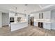 White kitchen with stainless steel appliances, quartz countertops, and a wine cooler at 10508 Mcalester Cir, Port Charlotte, FL 33981