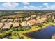 Aerial view of neighborhood near a lake at 11241 Sandhill Preserve Dr, Sarasota, FL 34238