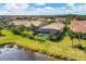 Aerial view of houses with pools and lush landscaping at 11241 Sandhill Preserve Dr, Sarasota, FL 34238