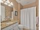 Clean bathroom with granite countertop and shower/tub combo at 11241 Sandhill Preserve Dr, Sarasota, FL 34238