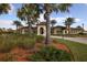 Community clubhouse with palm trees at 11241 Sandhill Preserve Dr, Sarasota, FL 34238