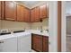 Laundry room with washer, dryer and ample cabinetry at 11241 Sandhill Preserve Dr, Sarasota, FL 34238