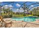 Relaxing pool and spa with screened enclosure at 11241 Sandhill Preserve Dr, Sarasota, FL 34238