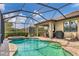 Inviting pool area with screened patio and grill at 11241 Sandhill Preserve Dr, Sarasota, FL 34238