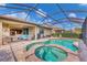 Spacious pool and spa with screened patio and outdoor seating at 11241 Sandhill Preserve Dr, Sarasota, FL 34238