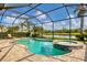 Relaxing pool and spa with screened enclosure and water view at 11241 Sandhill Preserve Dr, Sarasota, FL 34238