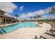 Resort-style pool with lounge chairs and a large patio at 11241 Sandhill Preserve Dr, Sarasota, FL 34238