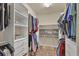 Large walk-in closet with ample shelving and hanging space at 11241 Sandhill Preserve Dr, Sarasota, FL 34238