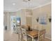 Elegant dining room featuring a wooden table and tasteful wall art at 11808 Sawgrass Lake Ter, Bradenton, FL 34211