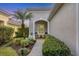 Inviting front porch with seating area and manicured landscaping at 11808 Sawgrass Lake Ter, Bradenton, FL 34211