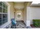 Inviting front porch with seating area and access to the home's entrance at 11808 Sawgrass Lake Ter, Bradenton, FL 34211