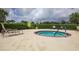 Relaxing hot tub surrounded by patio at 11808 Sawgrass Lake Ter, Bradenton, FL 34211