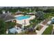 Community pool with lounge chairs and cabanas at 11808 Sawgrass Lake Ter, Bradenton, FL 34211