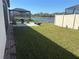 Outdoor living space with patio, lounge chairs, and a serene view of the pond at 12571 Night View Dr, Sarasota, FL 34238