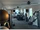 Well-equipped gym with modern exercise equipment and multiple ceiling fans at 12571 Night View Dr, Sarasota, FL 34238