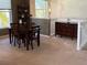 Bright dining area features a wooden table and access to a half-wall at 1274 Burgos Dr # 1101, Sarasota, FL 34238