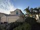 Two-story villa with a two-car garage and landscaping at 1274 Burgos Dr # 1101, Sarasota, FL 34238