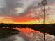 Beautiful sunset reflected in the calm lake water at 1274 Burgos Dr # 1101, Sarasota, FL 34238