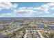 Aerial view of community with lake and homes at 12985 Bliss Loop, Bradenton, FL 34211