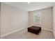 Bright bedroom with window and ottoman at 12985 Bliss Loop, Bradenton, FL 34211