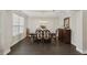 Formal dining room with dark hardwood floors and elegant furniture at 12985 Bliss Loop, Bradenton, FL 34211