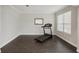 Small room with dark tile flooring and a treadmill at 12985 Bliss Loop, Bradenton, FL 34211