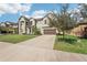 Two-story house with gray siding, brown garage door, and driveway at 12985 Bliss Loop, Bradenton, FL 34211