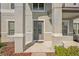 Gray front door with glass panels and sidelights at 12985 Bliss Loop, Bradenton, FL 34211