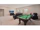 Game room boasts a pool table and comfortable seating at 12985 Bliss Loop, Bradenton, FL 34211