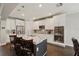 Modern kitchen featuring white cabinets, granite countertops, and stainless steel appliances at 12985 Bliss Loop, Bradenton, FL 34211