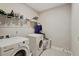 Laundry room with washer, dryer and shelving at 12985 Bliss Loop, Bradenton, FL 34211