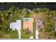 Aerial view showcasing a single Gathering home with a pool and canal access at 1313 Harbor Blvd, Port Charlotte, FL 33952