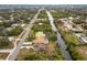 Aerial perspective showcasing the home's canal-side location and neighborhood setting at 1313 Harbor Blvd, Port Charlotte, FL 33952