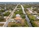 Aerial view of canal-front home with large backyard and dock at 1313 Harbor Blvd, Port Charlotte, FL 33952