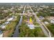 Aerial view highlighting home's canal-front location at 1313 Harbor Blvd, Port Charlotte, FL 33952