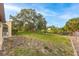 Spacious backyard with large tree and grassy area at 1313 Harbor Blvd, Port Charlotte, FL 33952