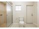 Bathroom with shower, toilet, and exterior access at 1313 Harbor Blvd, Port Charlotte, FL 33952