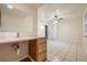 Bright bathroom with vanity, sink, and tiled floors at 1313 Harbor Blvd, Port Charlotte, FL 33952