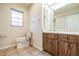 Bathroom with wood vanity and tile flooring at 1313 Harbor Blvd, Port Charlotte, FL 33952