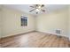 Bright bedroom with laminate flooring and ceiling fan at 1313 Harbor Blvd, Port Charlotte, FL 33952