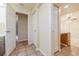 Hallway with tiled floor and linen closet at 1313 Harbor Blvd, Port Charlotte, FL 33952