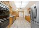 Kitchen with stainless steel appliances and wood cabinets at 1313 Harbor Blvd, Port Charlotte, FL 33952